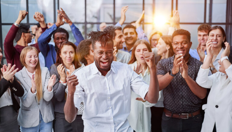 large international group of happy people applauding together